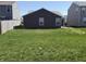 Lawn and view of back exterior at 10869 Spirit Dr, Ingalls, IN 46048
