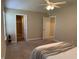 Bedroom showing bathroom access with carpeted floors and neutral color palette at 10869 Spirit Dr, Ingalls, IN 46048