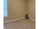 Bedroom with neutral walls and carpet, a window for natural light, and minimalist decor in a quiet space at 10869 Spirit Dr, Ingalls, IN 46048