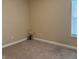 Neutral bedroom with a large window providing natural light, and minimalist decor for a quiet space at 10869 Spirit Dr, Ingalls, IN 46048