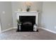 A traditional fireplace featuring a white mantel, black firebox, and decorative accessories at 10869 Spirit Dr, Ingalls, IN 46048