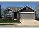 Charming single-Gathering home with brick and siding exterior and a two-car attached garage at 10869 Spirit Dr, Ingalls, IN 46048