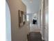 Inviting hallway with hardwood floors leading to a cozy living room with a fireplace at 10869 Spirit Dr, Ingalls, IN 46048