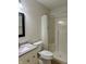 Functional bathroom featuring a toilet, shower, vanity, and mirror at 10949 Harness Way, Indianapolis, IN 46239