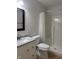 Bathroom with a white vanity, granite countertop, and a glass shower with a shower curtain at 10949 Harness Way, Indianapolis, IN 46239