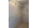 Walk in closet with white metal racks for maximum organization and storage at 10949 Harness Way, Indianapolis, IN 46239