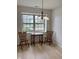 Cozy dining area featuring a window that looks out over the front yard at 10949 Harness Way, Indianapolis, IN 46239