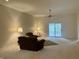 Large living room with slider glass door leading to a covered patio, offering seamless indoor-outdoor living at 10949 Harness Way, Indianapolis, IN 46239