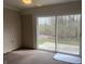 Cozy sunroom featuring sliding glass doors with view of the backyard at 10949 Harness Way, Indianapolis, IN 46239