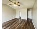 Large bedroom featuring ensuite bathroom and walk-in closet, complete with wood-look laminate flooring at 11147 Autumn Creek Ct, Indianapolis, IN 46229