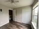 Bedroom featuring wood-look floors, a window, and closet at 11147 Autumn Creek Ct, Indianapolis, IN 46229