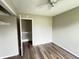 Bedroom with wood-look floors and access to another room at 11147 Autumn Creek Ct, Indianapolis, IN 46229
