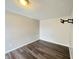 Bedroom with wood-look floors and wall-mounted TV bracket at 11147 Autumn Creek Ct, Indianapolis, IN 46229