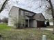 A two-story home featuring a brick and vinyl exterior, attached garage, and a well-maintained front yard at 11147 Autumn Creek Ct, Indianapolis, IN 46229