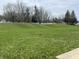 Expansive front yard featuring a healthy lawn and mature trees at 11147 Autumn Creek Ct, Indianapolis, IN 46229