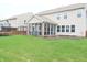 A screened in porch and large backyard are showcased in this shot at 11149 Titania Ct, Noblesville, IN 46060