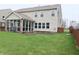 Expansive backyard features a screened-in porch, perfect for relaxing and enjoying the outdoors at 11149 Titania Ct, Noblesville, IN 46060
