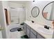 Stylish bathroom featuring double sinks, a tub with shower, and modern fixtures at 11149 Titania Ct, Noblesville, IN 46060
