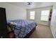 Bright bedroom featuring neutral walls and carpet, with two large windows for natural light at 11149 Titania Ct, Noblesville, IN 46060