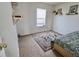 Cozy bedroom with a patterned rug, carpet floors, and a bright window at 11149 Titania Ct, Noblesville, IN 46060