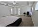 Large primary bedroom with a ceiling fan, a workstation, and access to a bathroom at 11149 Titania Ct, Noblesville, IN 46060