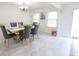Elegant dining room with marble floors, a stylish chandelier, and seating for six at 11149 Titania Ct, Noblesville, IN 46060