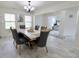 Elegant dining room with a chandelier, marble floors, and large windows for ample natural light at 11149 Titania Ct, Noblesville, IN 46060
