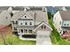 Beautiful two-story home featuring a manicured lawn and inviting curb appeal at 11149 Titania Ct, Noblesville, IN 46060