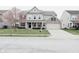 Charming two-story home with a combination of siding and brick, complemented by a well-manicured lawn at 11149 Titania Ct, Noblesville, IN 46060