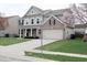 Charming two-story home with a two car garage and well-manicured lawn at 11149 Titania Ct, Noblesville, IN 46060