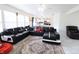 Inviting living area with a plush sectional sofa, marble-like flooring, and abundant natural light at 11149 Titania Ct, Noblesville, IN 46060