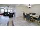 Open-concept living and dining areas feature luxury flooring and a modern chandelier at 11149 Titania Ct, Noblesville, IN 46060