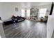 Spacious living room with a modern couch, hardwood floors, and ample natural light at 11149 Titania Ct, Noblesville, IN 46060