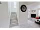 Interior staircase featuring marble steps with white risers leading to the upper level at 11149 Titania Ct, Noblesville, IN 46060