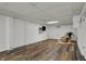 Basement featuring updated flooring and a mounted tv creating a relaxing space at 1123 Woodbridge Ln, Indianapolis, IN 46260