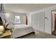 Bedroom featuring a large bed, wood floors, and a window at 1123 Woodbridge Ln, Indianapolis, IN 46260