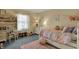 bedroom featuring a desk, vanity, and whimsical decor at 1123 Woodbridge Ln, Indianapolis, IN 46260