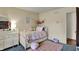 bedroom featuring a bed, dresser, and pink accents at 1123 Woodbridge Ln, Indianapolis, IN 46260