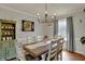 Charming dining room with wood floors, rustic table setting, and elegant decor at 1123 Woodbridge Ln, Indianapolis, IN 46260