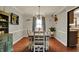 Dining area with hardwood floors, and large table perfect for Gathering dinners at 1123 Woodbridge Ln, Indianapolis, IN 46260