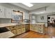 This kitchen features wood cabinets, stainless steel appliances, and a window above the sink at 1123 Woodbridge Ln, Indianapolis, IN 46260