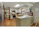 This kitchen features wood cabinets, stainless steel appliances, and an adjacent dining area at 1123 Woodbridge Ln, Indianapolis, IN 46260