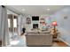 The living room features a brick fireplace, built-in bookshelves, and sliding glass doors at 1123 Woodbridge Ln, Indianapolis, IN 46260