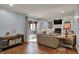 The living room features a brick fireplace, built-in bookshelves, and sliding glass doors at 1123 Woodbridge Ln, Indianapolis, IN 46260