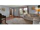 A comfortable living room with cozy couch, neutral rug, and bright natural light at 1123 Woodbridge Ln, Indianapolis, IN 46260