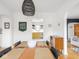 Stylish dining room with a wooden table, a black wicker chandelier, and a view into the kitchen at 1139 N Butler Ave, Indianapolis, IN 46219