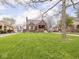 Charming brick home with a well-manicured front yard, mature trees and inviting curb appeal at 1139 N Butler Ave, Indianapolis, IN 46219