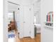 Hallway showcasing seamless transition from living room to bedroom with hardwood floors throughout at 1139 N Butler Ave, Indianapolis, IN 46219