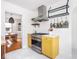 Modern kitchen featuring stainless steel appliances and view into adjacent dining room at 1139 N Butler Ave, Indianapolis, IN 46219