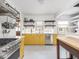 Bright, modern kitchen with yellow cabinets, stainless steel appliances, and a functional open layout at 1139 N Butler Ave, Indianapolis, IN 46219